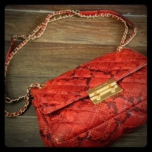 Red and black MK snake skin print handbag.